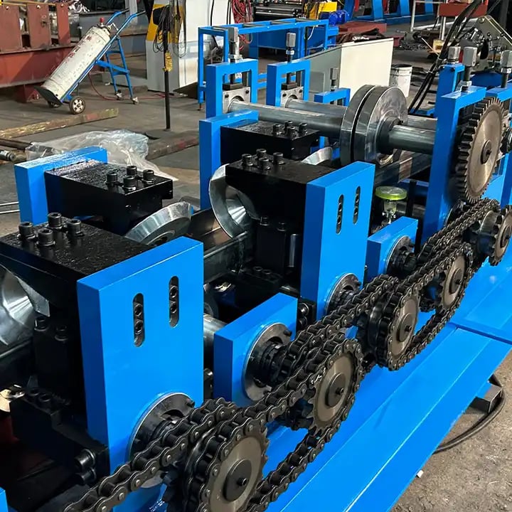 Close-up of forming rollers and shafts